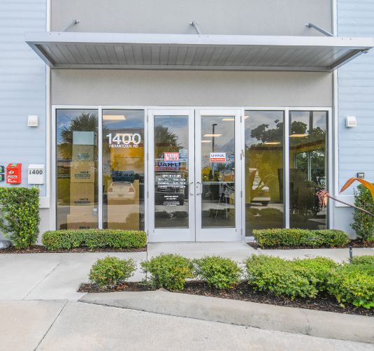 Value Store It storefront exterior with glass entry doors and address 1400 visible.