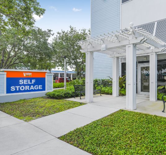 Value Store It self-storage facility entrance with white pergola and signage.