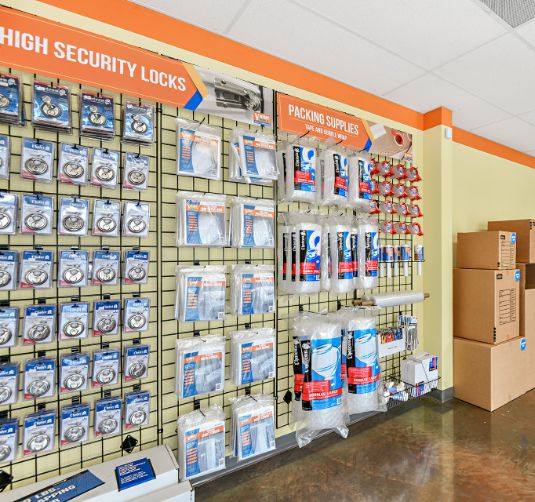 High security locks and packing supplies display at Value Store It facility.