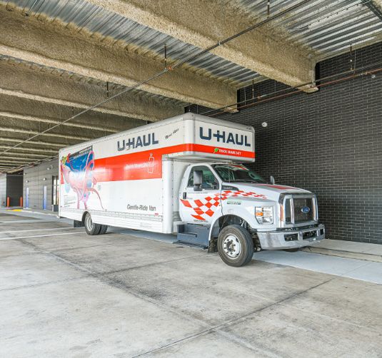 U-Haul moving truck parked inside Value Store It climate-controlled storage facility.